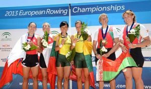 Silver medallists Poland (Magdalena Fularczyk, Natalia Madaj), gold medallists Lithuania (Donata Vistartaite, Milda Valciukate) and bronze medallists Belarus (Ekaterina Karsten, Yuliya Bichyk) celebrate during the medal ceremony of the women's double sculls at the 2013 European Rowing Championships in Sevilla, Spain